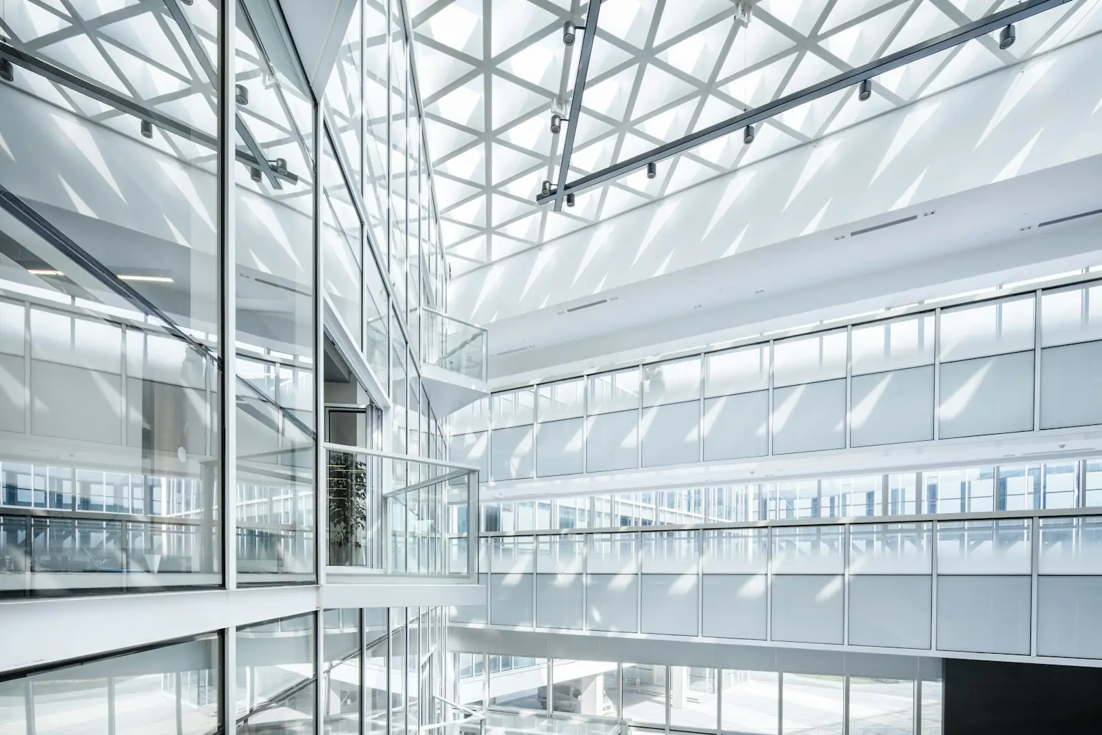 A bright glass atrium in a modern office building